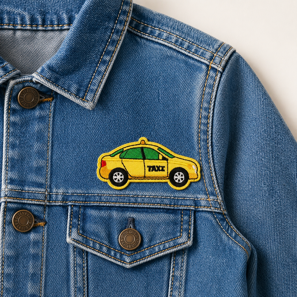 Taxi Gul - Strykbart tøymerke